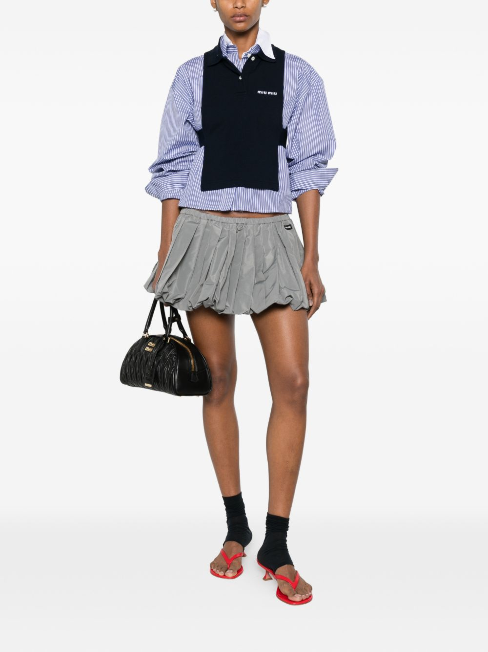 [Miu Miu] Mini skirt FW26 MG2723121IF0112